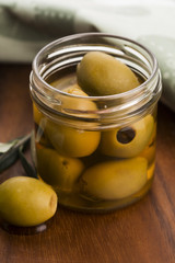 pickled olives and olive tree branch