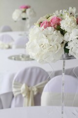 Flower arrangement  for wedding table. Hydrangea and roses.
