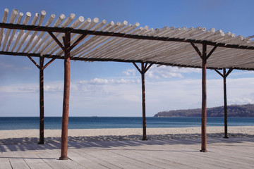 Wooden shelter on the beach near the sea