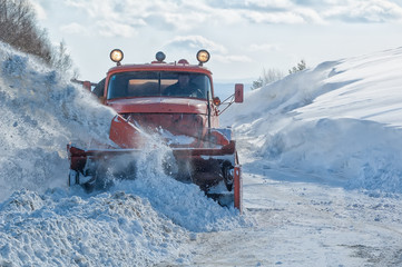 truck cleaning road in winter