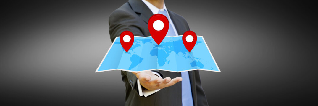 Businessman holding digital map in his hands