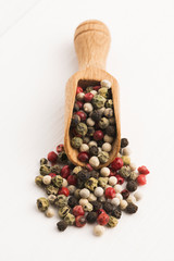 Mixed green, red, white and black peppercorns
