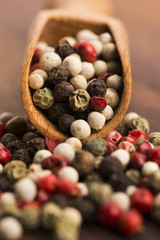 Mixed green, red, white and black peppercorns