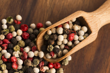 Mixed green, red, white and black peppercorns