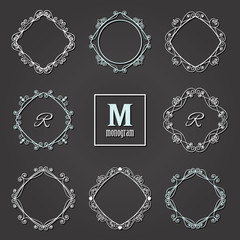 Filigree frames set on blackboard. Monogram design.