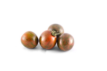 Obraz premium Kumato tomatoes, isolated
