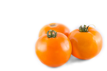 yellow tomato isolated on white