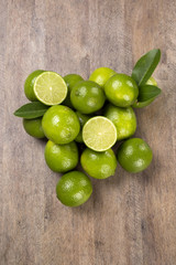 Fresh citrus lime with mint close up on wooden background