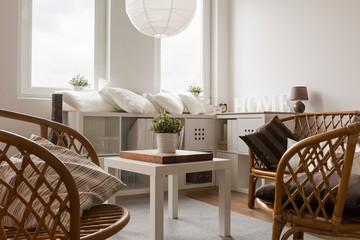 Wicker chairs and white table