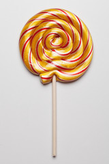 Yellow Sweet Lollipop For Children On White Background