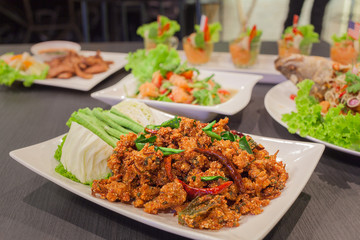 Thai cuisine spicy crispy pork salad, Larb with spicy salmon and