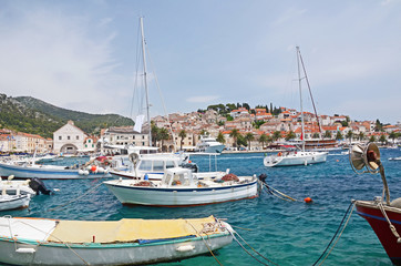Fototapeta na wymiar Boats anchoring in Hvar city port on island Hvar, Dalmatia, Croatia