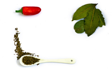 Spices. Spices in ceramic spoon over white background. Zira and