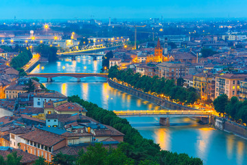 Fototapeta na wymiar River Adige and bridges in Verona at night, Italy