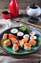 homemade sushi with wild salmon, shrimp, cucumber and seaweed. selective focus