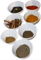 Food condiments in round dishes.