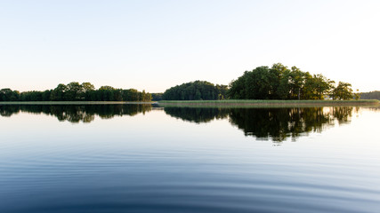 symmetric reflections on calm lake