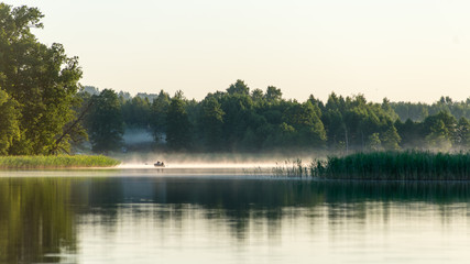 Obraz na płótnie Canvas symmetric reflections on calm lake
