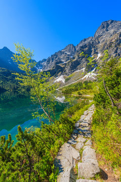 Path along beautiful green water Morskie Oko lake, Tatra Mountains, Poland © pkazmierczak