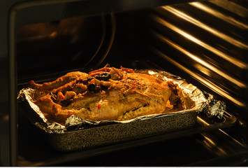 roast duck in the oven cooking in the oven