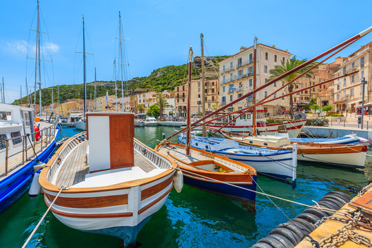 Fototapeta Colorful typical fishing boats in Bonifacio port, Corsica island, France