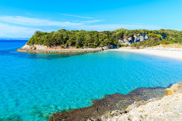 Turquoise sea water of Petit Sperone bay with beautiful beach, Corsica island, France
