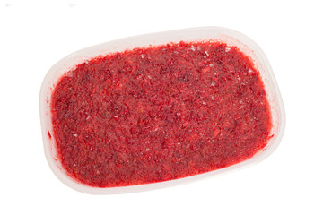 Frozen mashed strawberries in plastic box - 87478643
