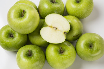 Some green apples on a white background