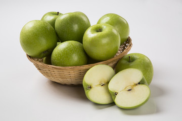 Some green apples on a white background