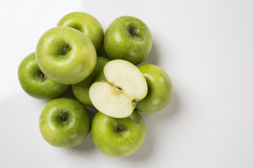 Some green apples on a white background
