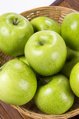 Some green apples on a white background