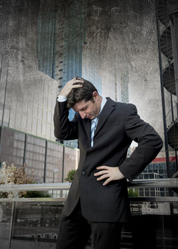 exhausted worried businessman outdoors in stress and depression