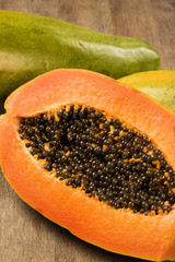 Fresh cut juicy tropical papaya mamao fruit with seeds at Brazil