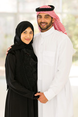 young muslim couple holding hands
