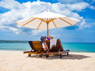 Couple of tourists on the beach