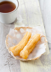 Deep fried traditional Thai dough stick in bamboo basket