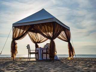 Romantic dinner setting on the beach