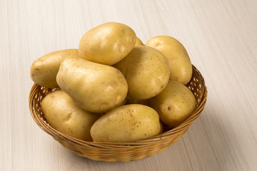 Fototapeta na wymiar Some potatoes over a white background