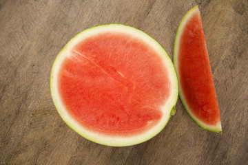 slices of watermelon on wooden table