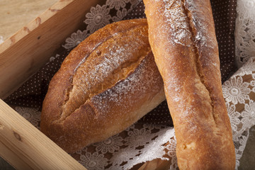 Bread, a set of variation of breads on a wood chopping block with spike
