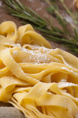 Fresh Pasta, close-up texture of Home made tagliatelle pasta flour ribbon noodle
