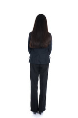 Asian business woman from the back looking at something isolated