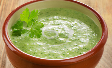 Creamy soup on a wooden table.