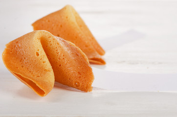 Fortune cookies with blank paper on white background.