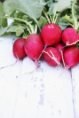 radishes on a white plank