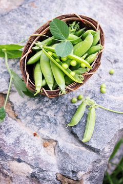 green peas on a stone , top view