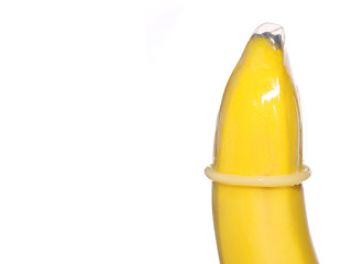 Banana with Condom isolated on background. Contraceptive Concept