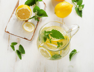 Water with fresh lemon and mint leaves