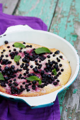 Pies with blueberries in the pan