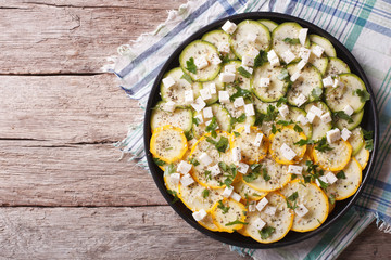 carpaccio of zucchini with cheese and herbs horizontal top view
